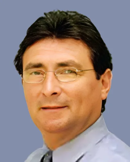 Portrait of Dr. Salvatore Degliuomini, MD, in a white coat with a stethoscope