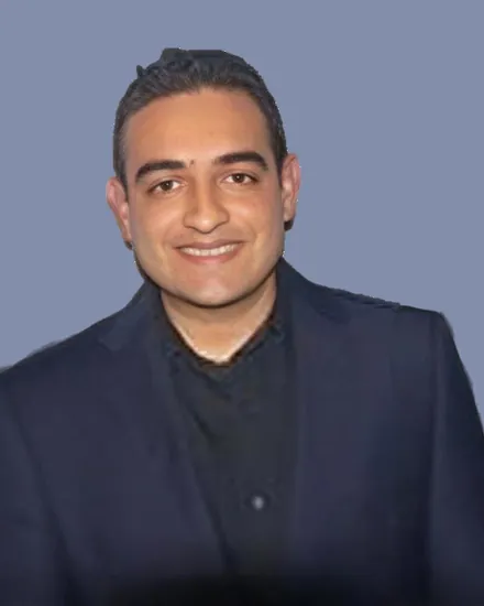 Portrait of Dr. Vikas Desai, MD, wearing a dark blazer